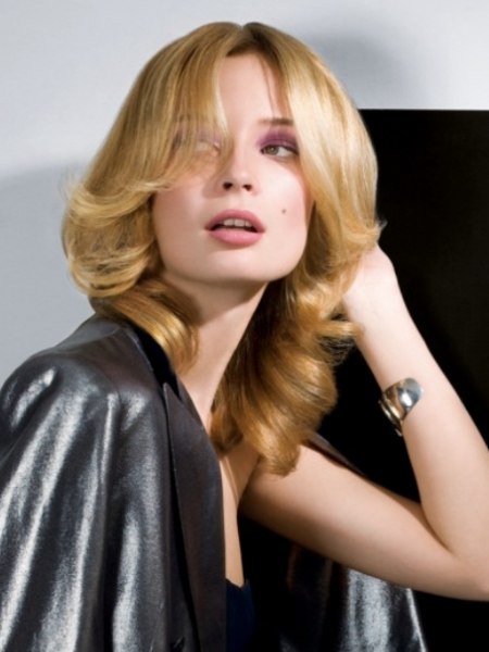 Very modern cut for long blonde hair