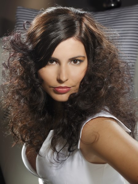 Long 60s hair style with curls and a side partition