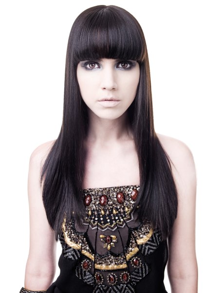 Sleek long hair with a thick fringe