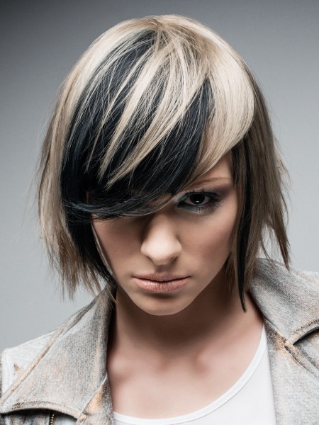 Chin long bob with layers of blonde, black and brown hair