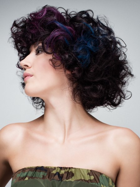Dark curly hair with blue and purple streaks