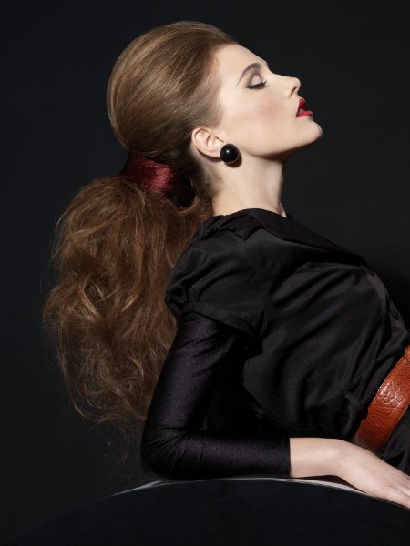 Brown hair styled in a pulled-back ponytail