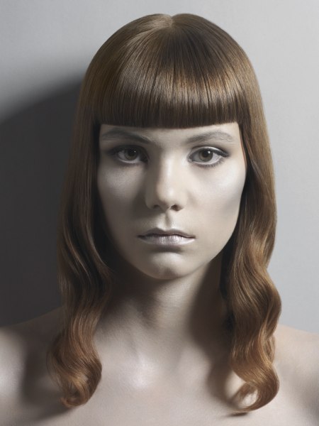 Below the shoulders hairstyle with full blunt bangs