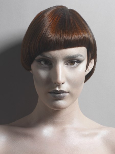Short asymmetrical hairstyle with an exposed ear lobe