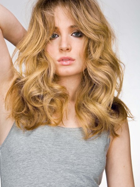 Long curly hair in a 1960s Brigitte Bardot style