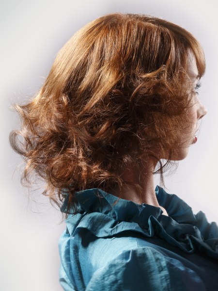 Side view of a retro inspired hairstyle with curls