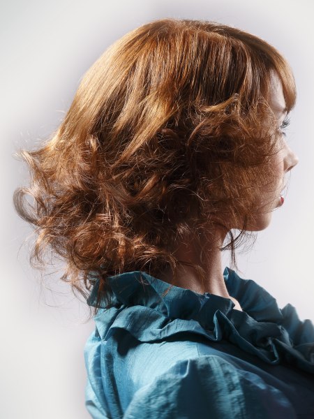 Side view of a retro-inspired hairstyle with curls