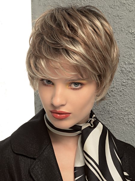 Longish pixie with feathered styling and lift at the scalp