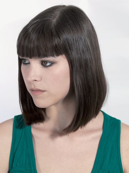 Long pageboy haircut with a point-cut fringe