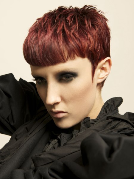 Short red hair with a short straight fringe