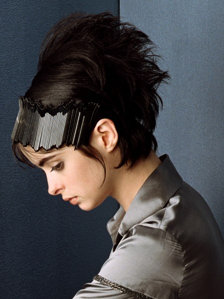 Short hairstyle with a large headband and a silk blouse