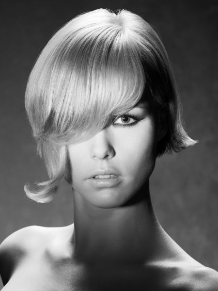 Short asymmetrical bob hairstyle with the fringe curved downward