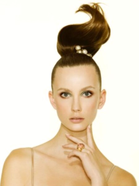 Hair pulled into an elegant smooth and sleek ponytail
