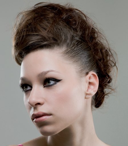 Hair in a high updo for an Amy Winehouse look