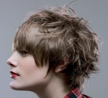 Boyish women's haircut with gel styling