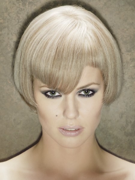 Beveled bob haircut with a notch above the eye