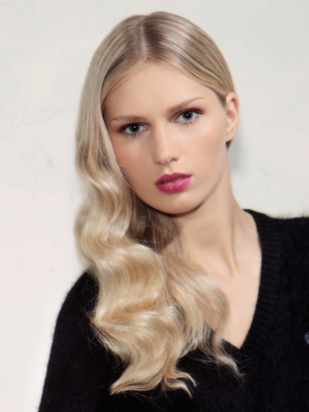 Long blonde hair with waves parted in the center