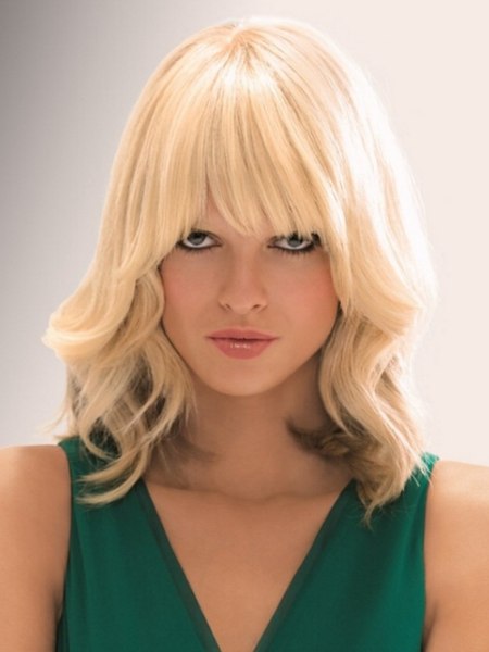 Blonde shoulder long hair styled with increased volume