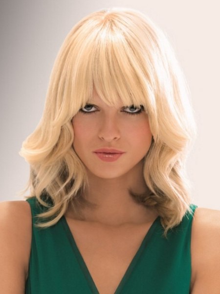 Blonde shoulder-length hair styled with increased volume