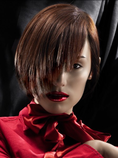 Short hairstyle with a steep angle and highlights