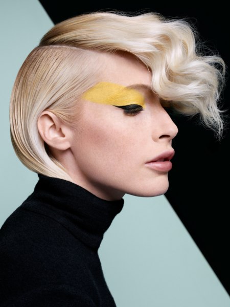 Hair tucked into the collar of a turtleneck sweater