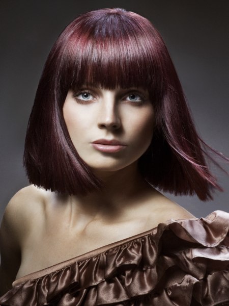 Shoulder-length bob with point-cut ends and smooth styling