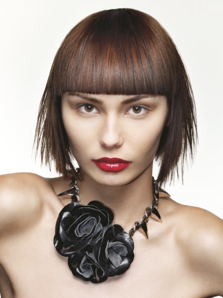 Short blunt cut hairstyle with straight bangs