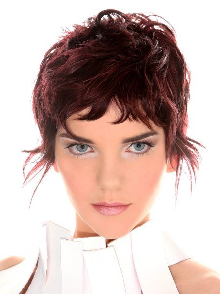 Layered short pixie haircut with hair in front of each ear