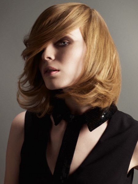 Medium length hairstyle with a side-swept fringe