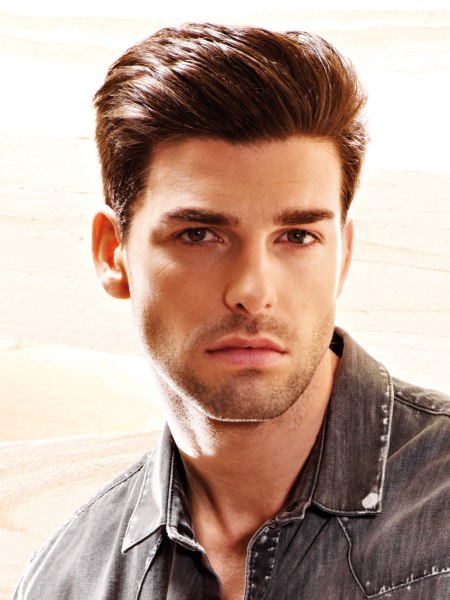 Men's fashion hairstyle with short sides and a longer top