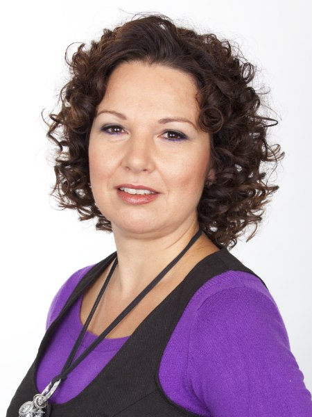 Hairstyle with joyful curls for 40-plus woman