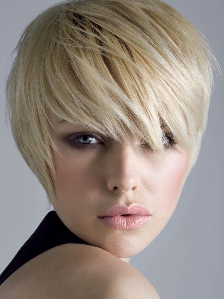 Short pixie hairstyle with a lash length fringe