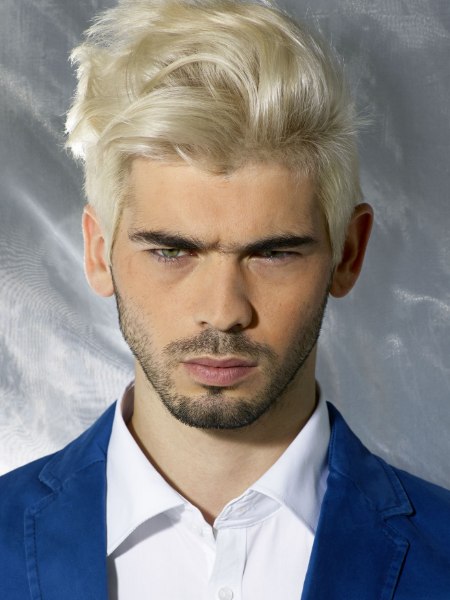 Man with blonde hair and a dark stubble beard