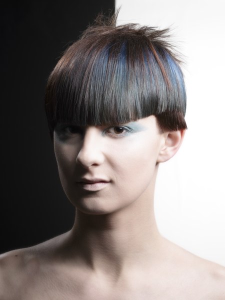 Short geometric hair style with blunt cut bangs