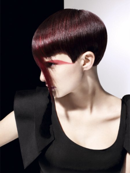 Maroon and berry hair color with a revealed ear