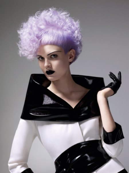 Short and daring modern hairstyle with a purple hue