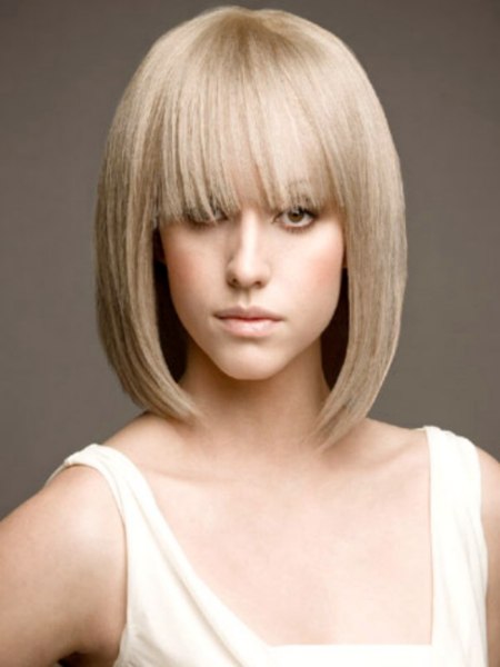Blonde just above the shoulders bob hairstyle with a soft fringe