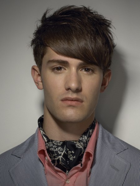 Men's haircut with layers and heavy bangs