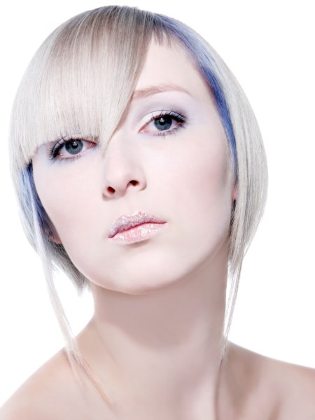 Blonde chin length straight bob with metallic blue coloring
