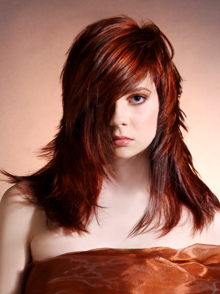 Face framing long red hair with sweeping motion