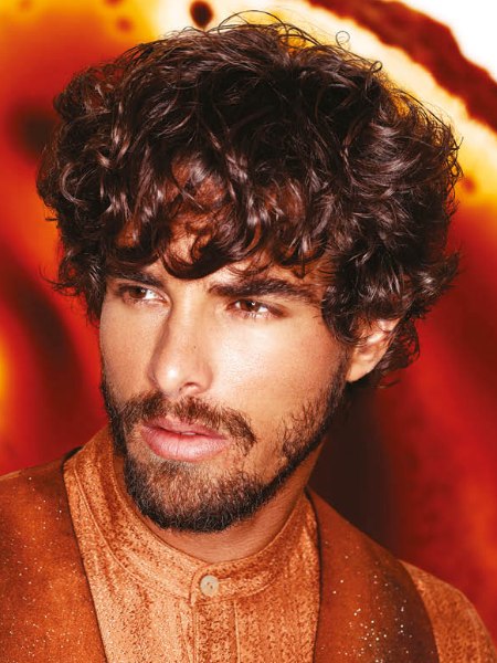 Men's hairstyle with short curls and a beard