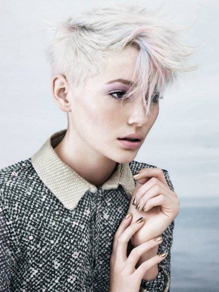 Very short blonde hair with accents in rose and blue