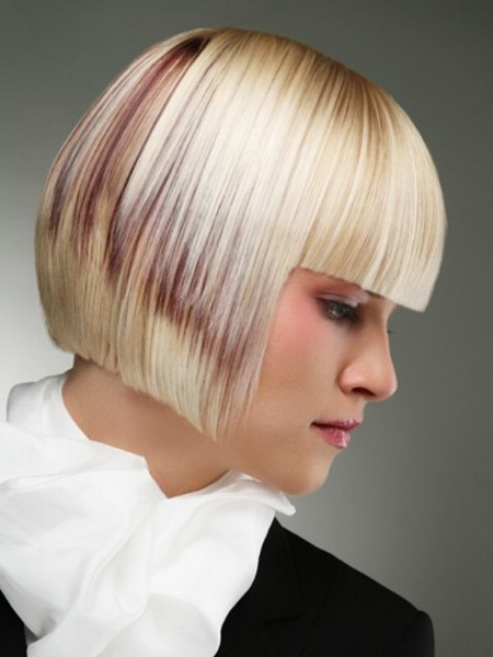 Precise cut bob with straight bangs and a blunt cutting line at chin length