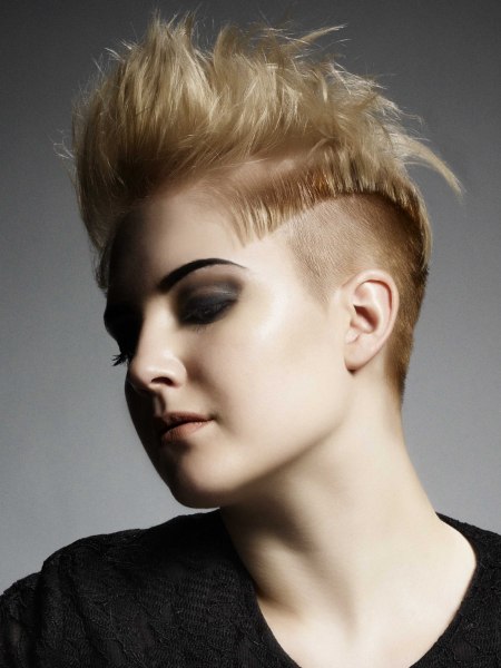 Short women's haircut with buzz cut sides