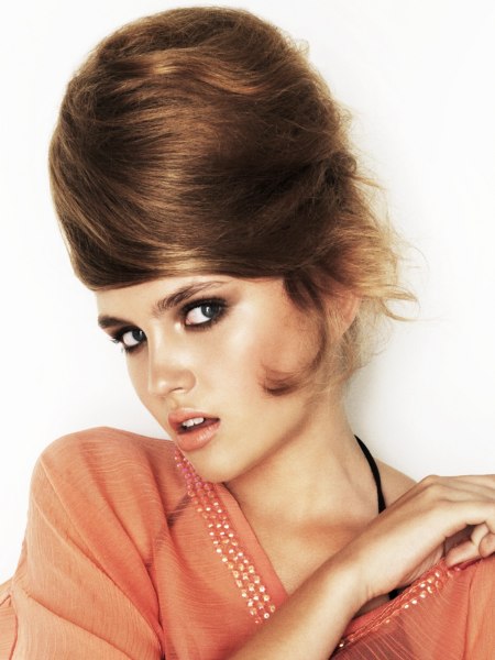 Sixties beehive hairdo with the hair wrapped into a vertical swirl