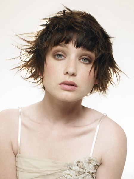 Short mussed up hair with flipped up ends and a sleek fringe