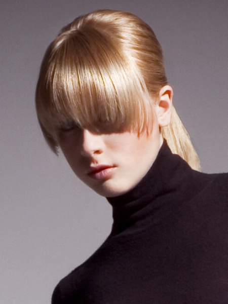 Hair cut with a long curved fringe