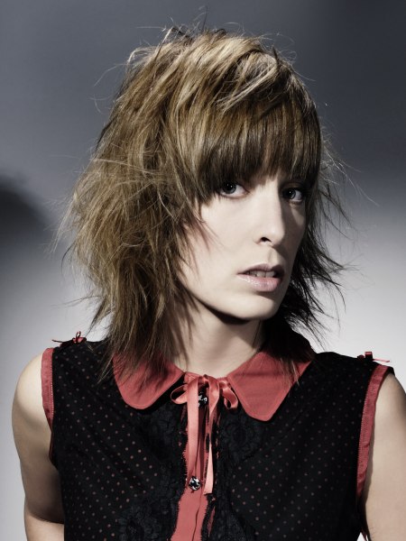 Medium-length layered hairstyle with thick curved bangs
