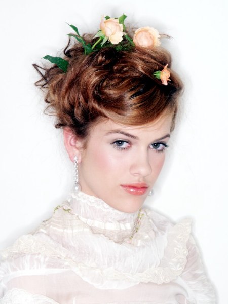 Updo with flowers pinned into the hair