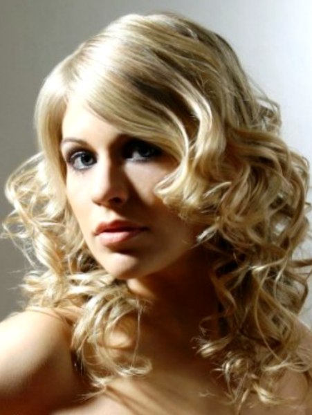Long multi-tonal blonde hair with crisp curl